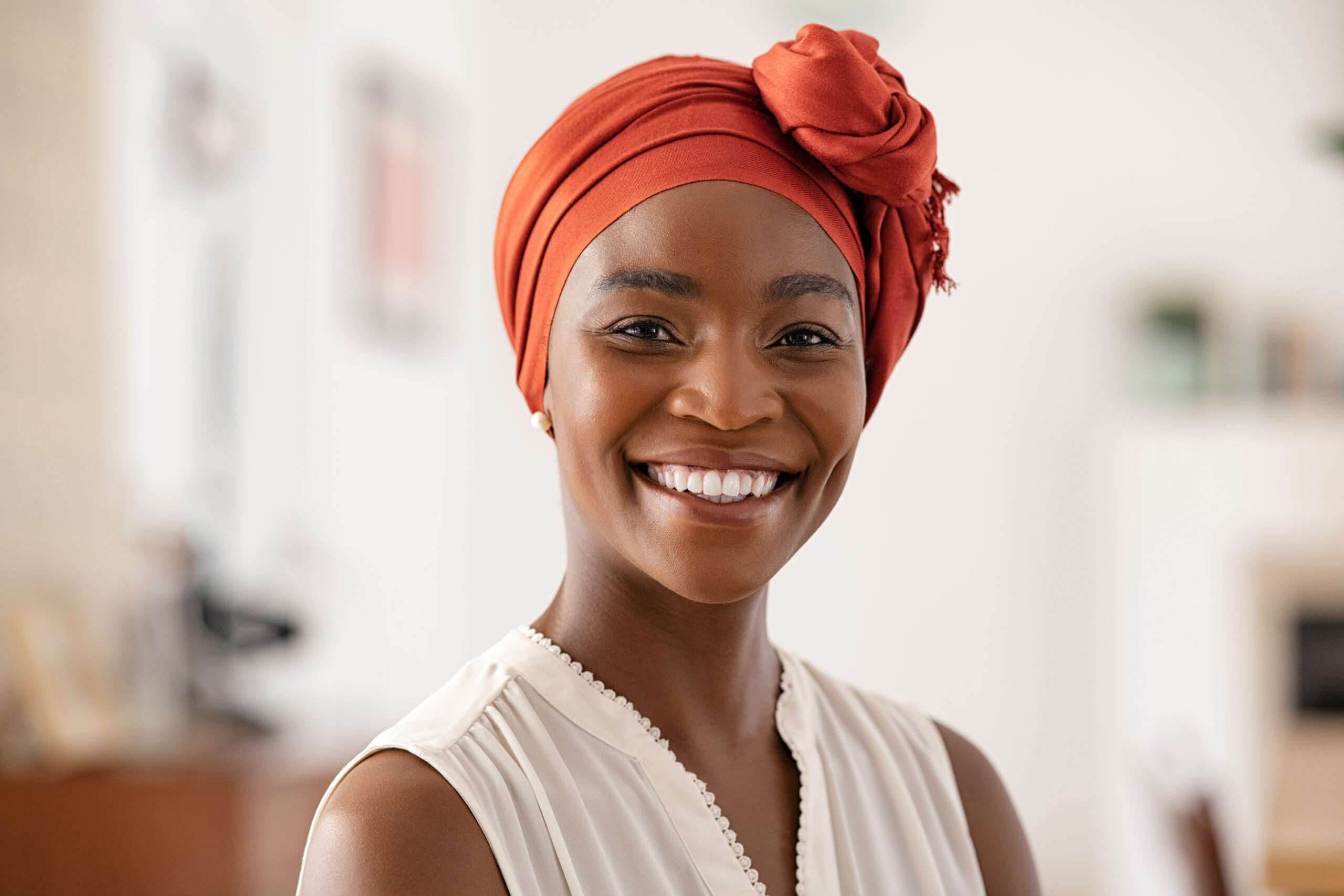 Kalandemy home page Connect With Our Experts smiling african woman with scarf side image