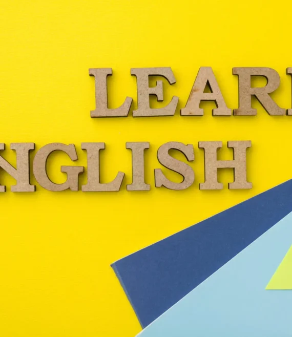 Learn English, words in wooden letters with yellow background