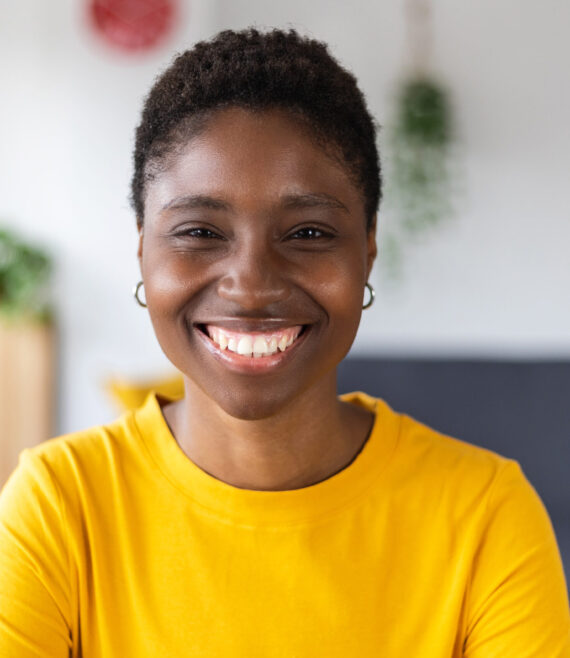 Portrait screen view of smiling millennial african woman on video call at home